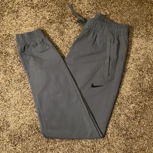 NIKE. MEN’S DRESS JOGGERS. SIZE SMALL. GRAY. ELASTIC AT ANKLES. LIKE NEW. EUC
